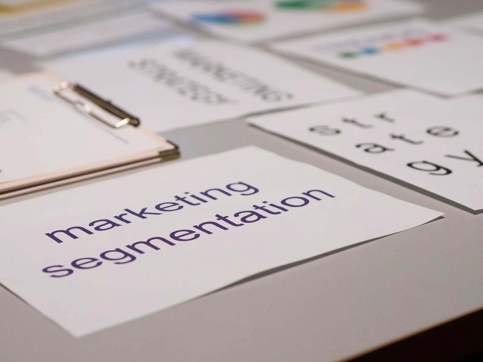 Close-up of various marketing documents on a desk, perfect for business and strategy discussions.